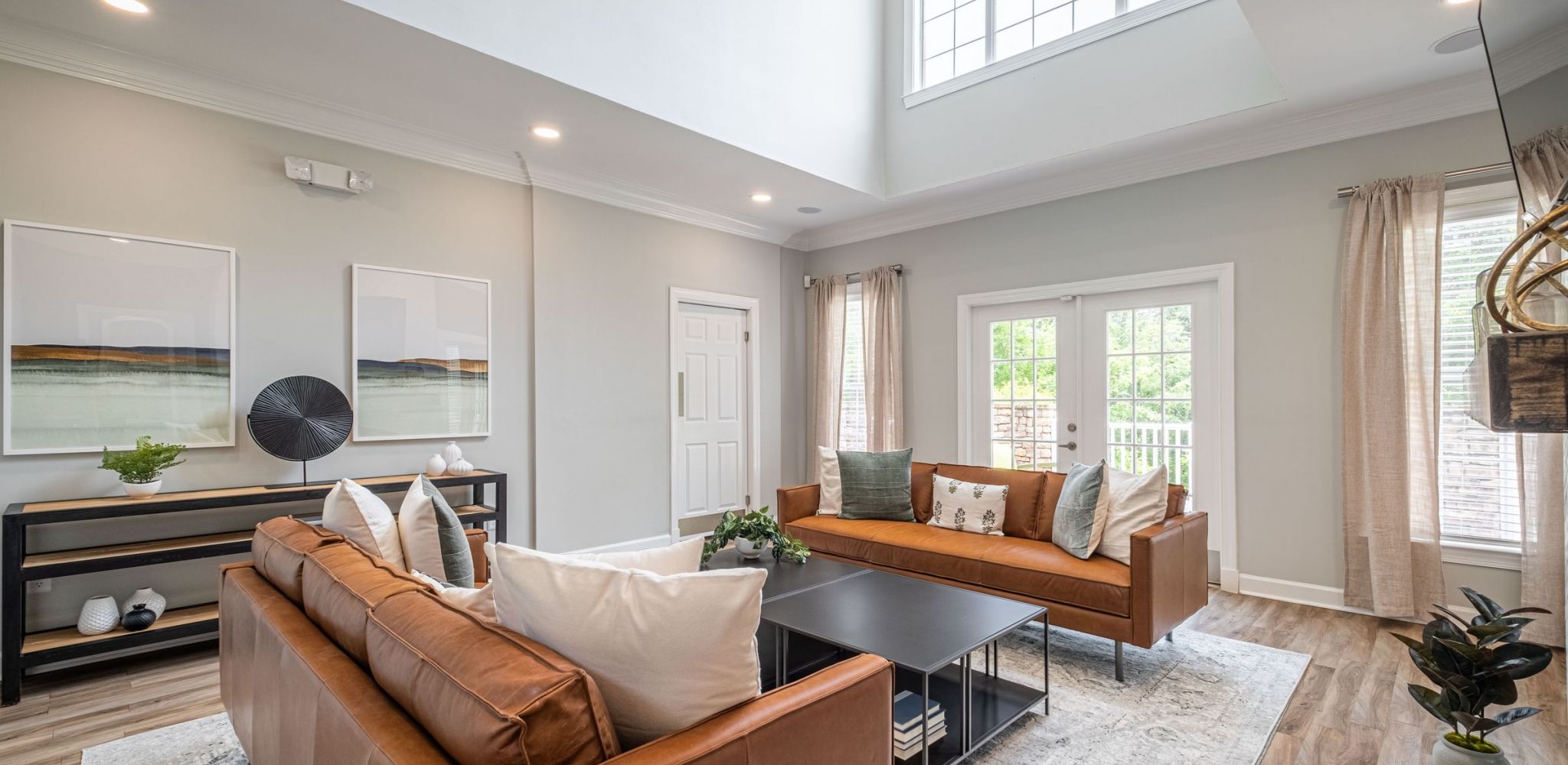 Hawthorne at Lake Heather entrance to resident clubhouse with a welcome desk and ample seating for guests.